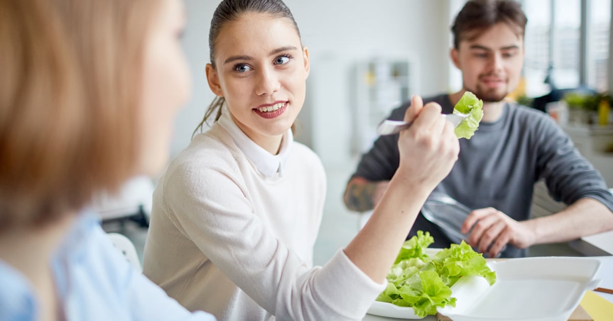 Woman eating lunch provided by employer