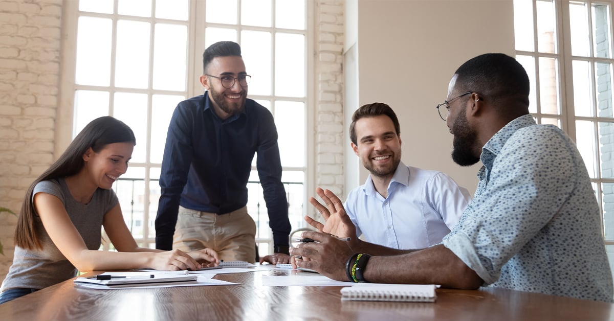 Employees engaging with one another on project